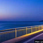 강릉 정동진 야경 - A serene night scene of Gangneung coastal promenade illuminated by gentle warm lights along the walk...